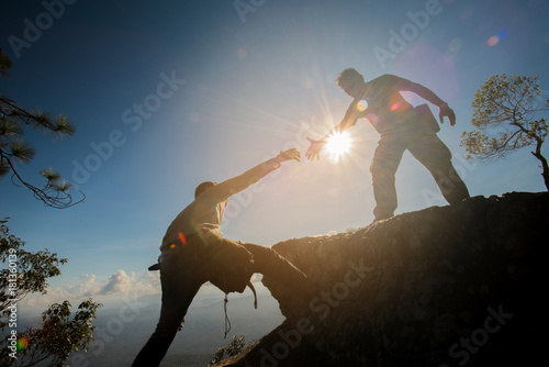 Man helping to climb the rock