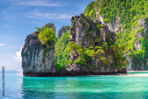 rock covered with trees in the Andaman Sea on the island of Hong, Thailand