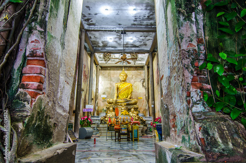 Unidentified people pray golden Buddha statue inside the ancient temple of Wat Bang Kung , founded in 1707, at Amphawa on Aug 21, 2017 in Samut Songkhram, Thailand.