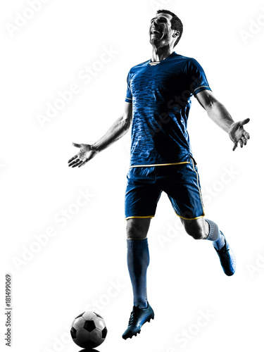 one caucasian soccer player man playing in silhouette isolated on white background