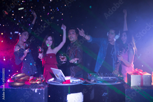 Night club and DJ party with friends, dancing and celebrating concept