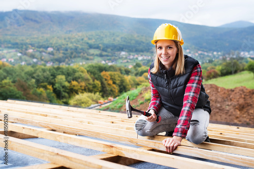 Young woman worker on the construction site.