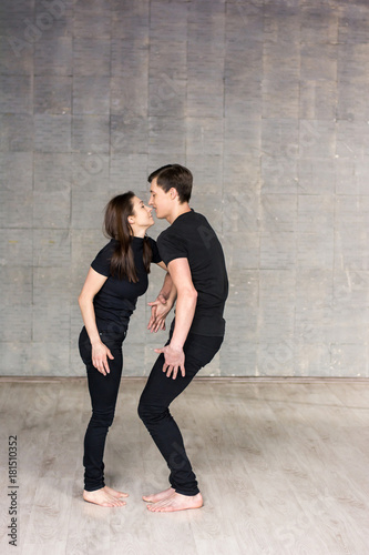 Couple of dancers holding hands. Young couple of dancers dancing passionate and romantic dance on studio background.