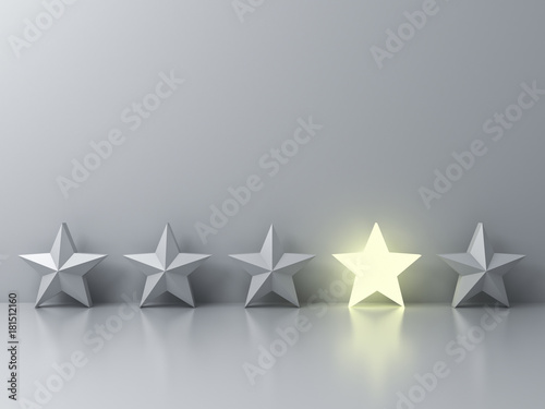 Stand out from the crowd and different creative idea concepts , One glowing star standing among other dim stars on grey background with reflections and shadows . 3D rendering.