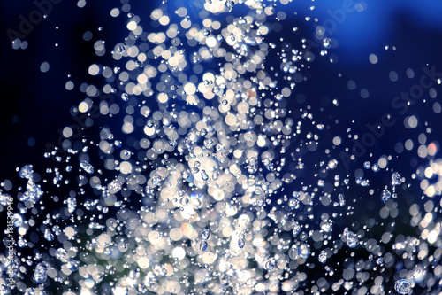 the blurred drops of water spray fountain