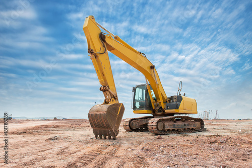 Heavy earth mover with blue sky in the background