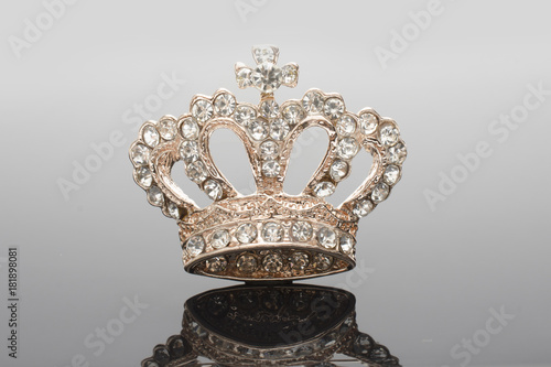 golden brooch crown isolated on black