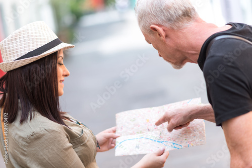 Pretty young woman asking for direction