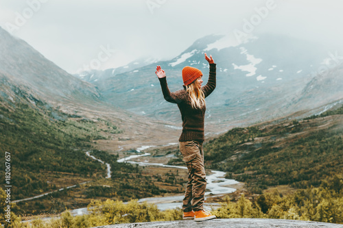 Woman walking outdoor happy emotions foggy mountains on background Travel Lifestyle success concept adventure active vacations in Norway Jotunheimen park