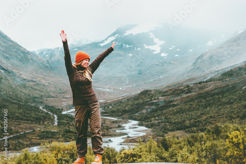 Traveling Woman happy enjoying foggy mountains landscape outdoor emotions Lifestyle success concept adventure active vacations in Norway Jotunheimen park