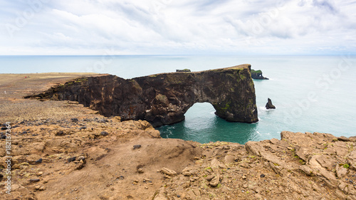 view of lava arch on Dyrholaey cliff in Iceland