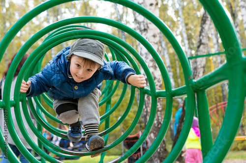 boy playing at a children's playground