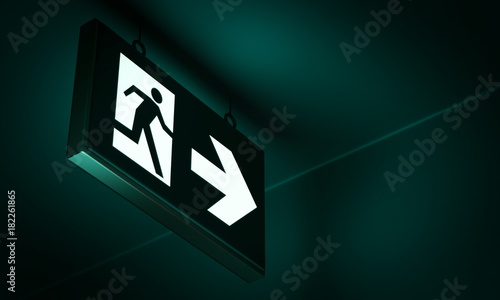 Emergency exit sign in corridor point way out of building - 3d render