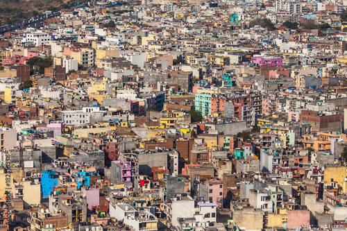 Aerial view on chaos of colored buildings - the heap of houses in the Asian cities caused by big human overpopulation.