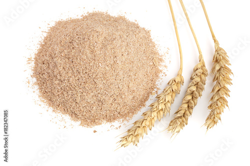 Pile of wheat bran with ears isolated on white background