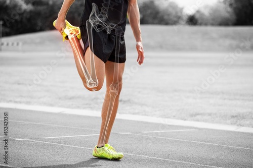 Highlighted bones of athlete man stretching on race track