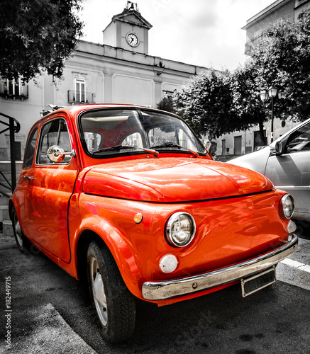 vintage red italian car old selective color black and white italy town 500