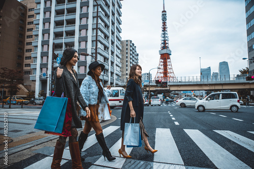 Group of japanese women spending time in Tokyo, making shopping in differents areas of the city