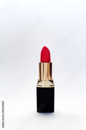 red lipstick on white background .