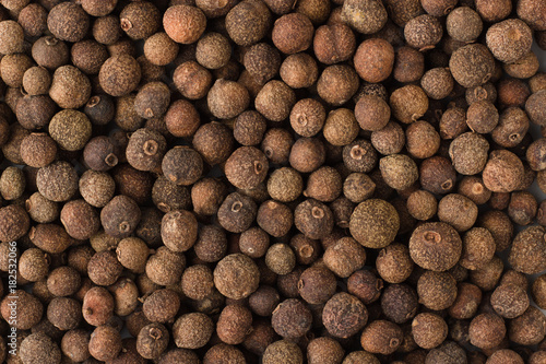 allspice spice as a background, natural seasoning texture