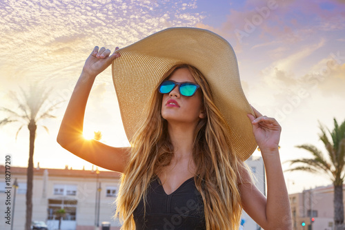 Blond teen girl sunglasses and pamela sun hat