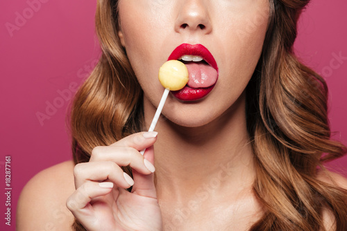 Cropped photo of woman lick lollipop isolated