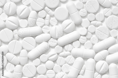 White pills, white background