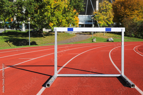 Athletic track with hurdle