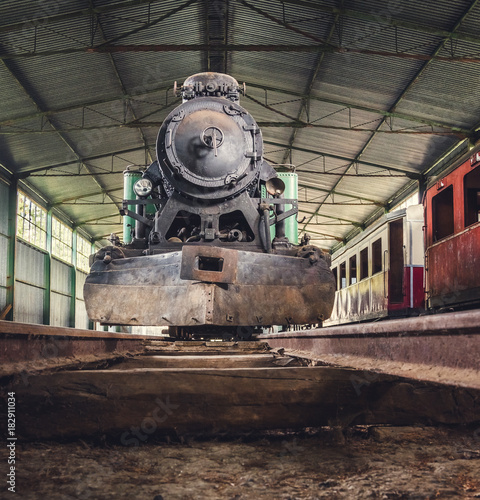 Front View of an Old Steam Locomotive Standing in the Depo