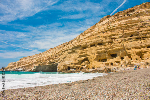 Matala, beautiful beach on Crete island, waves and rocks.