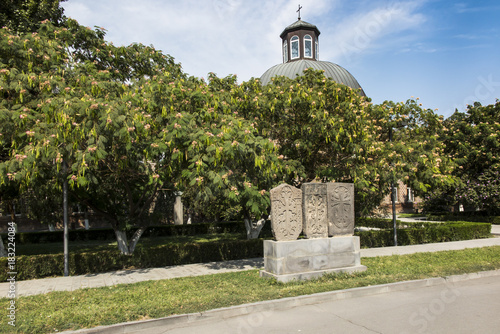 Stone cross in Echmiadzin (Vagharshapat) made of red stone tufa. ,