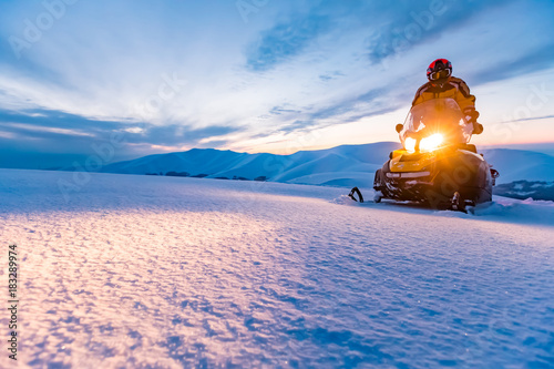 A rider on the snowmobile.