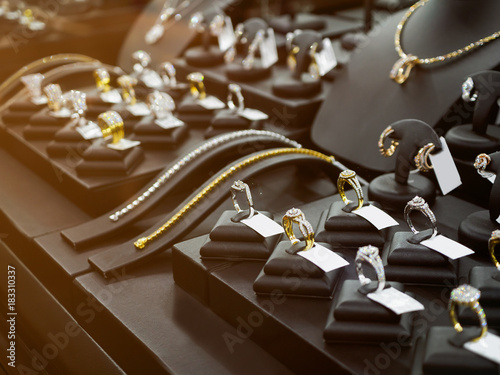 Gold jewelry diamond shop with rings and necklaces luxury retail store window display