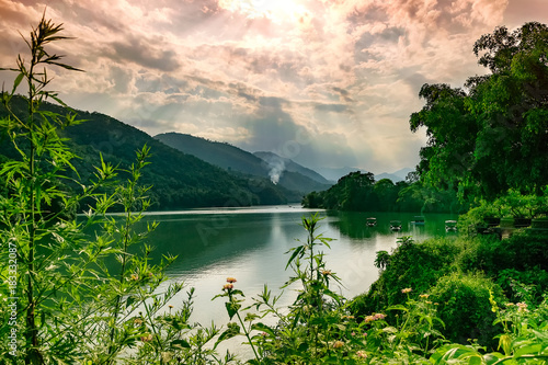 warm views with boats in phewa lake in pokara. nepal