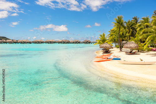 Orange kayaks on white sand beach, Bora Bora, French Polynesia, South Pacific Concept for relaxation, vacation, resort