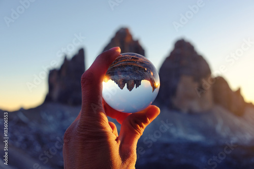 Tre Cime mountain view through crystal glass globe