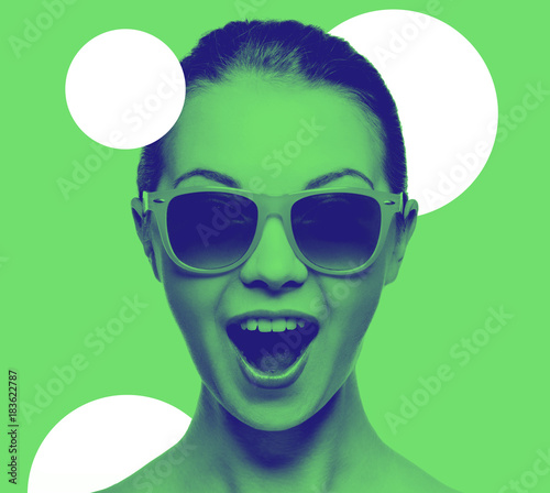 happy amazed teenage girl in sunglasses