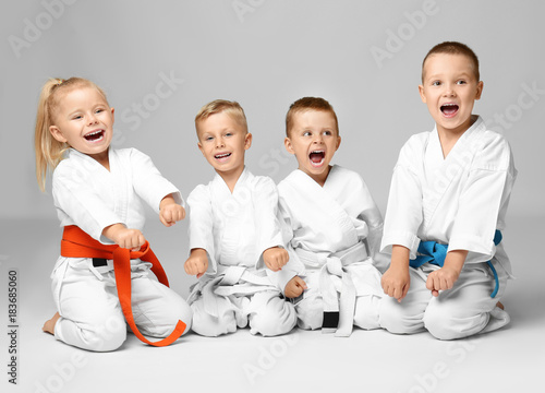 Little children in karategi on light background
