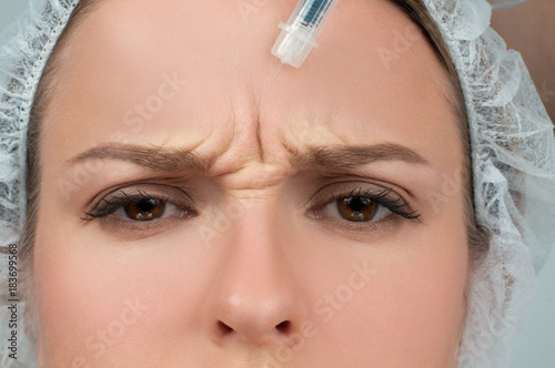 Woman is getting botox injection. Anti-aging treatment and face lift. Cosmetic Treatment and Plastic Surgery