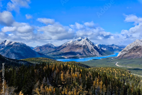 Canadian Rokies landscape with lakes and mountains covered with snow and golden larches in autumn. Tents Ridge Horseshoe. Spray Lake in Spray Valley Provincial Park. Kananaskis. Alberta. Canada.