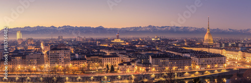 Turin, Italy: cityscape at sunrise with details of the Mole Antonelliana of Torino