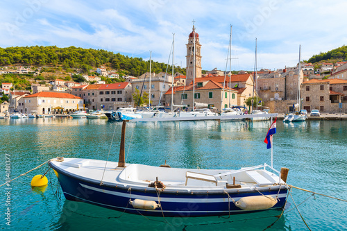 Fishing boat mooring in picturesque Pucisca port, Brac island, Croatia