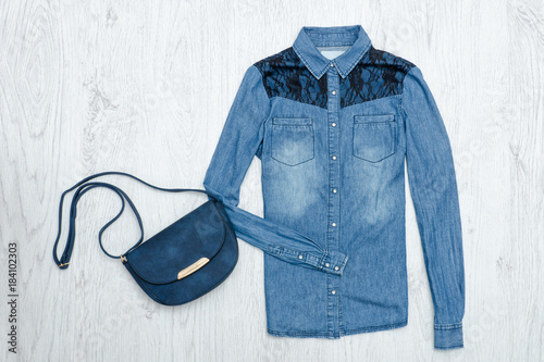 Blue jeans shirt and handbag. Fashionable concept