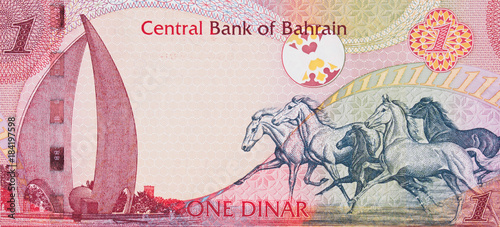 Galloping Arabian Horses and the Sail and Pearl monument on Bahrain one dinar (2006) banknote closeup macro, Bahraini money close up.