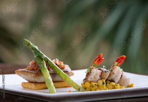 haute cuisine Pan fried fish fillet of barramundi with shrimps