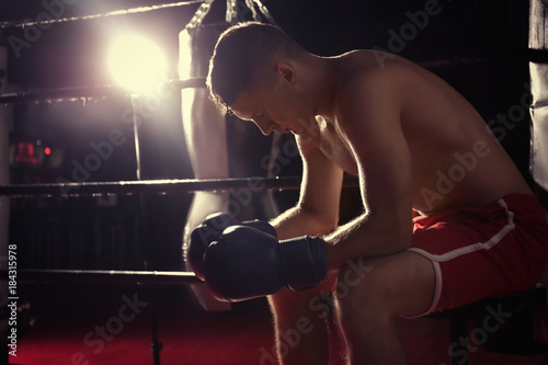 Professional boxer having break during training