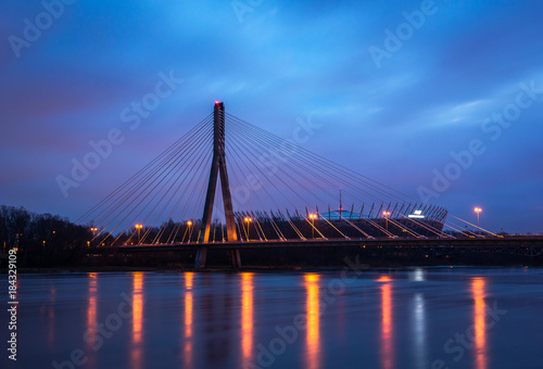 Dawn on the Swietokrzyski bridge over the Vistula river in Warsaw, Poland