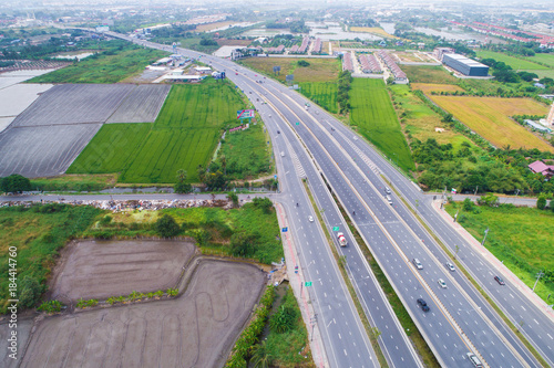 Motorway traffic junction road surrounded by green tree