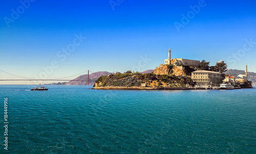 San Francisco bay with Alcatraz Island and Golden Gate Bridge on sunny day