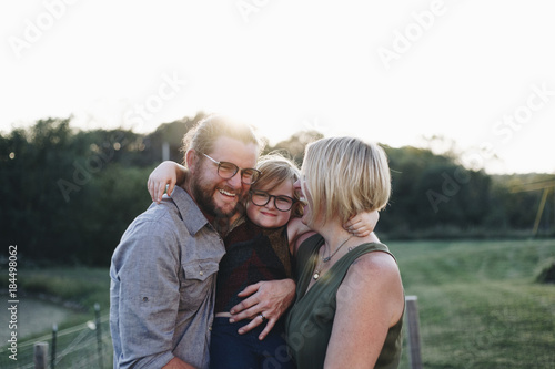 A Caucasian family is spending time at the farm together